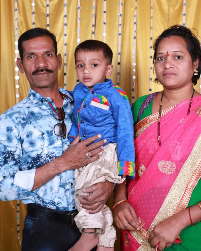 A family photographed with their child at Shobha Nursing Home (1 of 8)